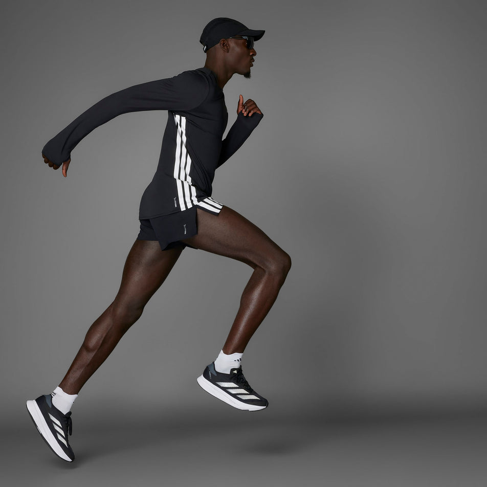 Side view of a model wearing the adidas Men's Adizero Gel Pocket Shorts in the Black colourway.