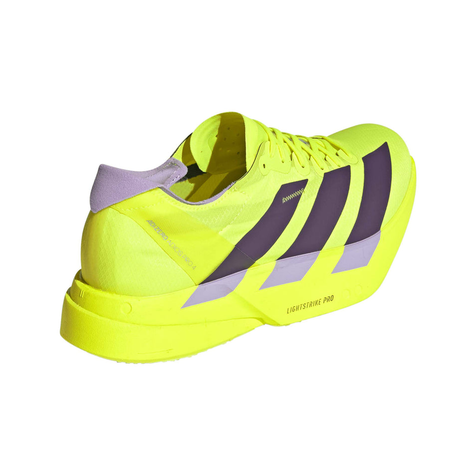 Lateral view of the right shoe from a pair of adidas Men's Adizero Adios Pro 4 Running Shoes in the Solar Yellow/Aurora Plum/Powder Plum colourway.