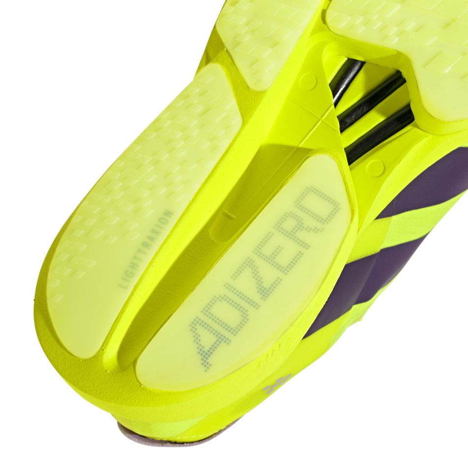 The rearfoot section of the right shoe from a pair of adidas Men's Adizero Adios Pro 4 Running Shoes in the Solar Yellow/Aurora Plum/Powder Plum colourway.