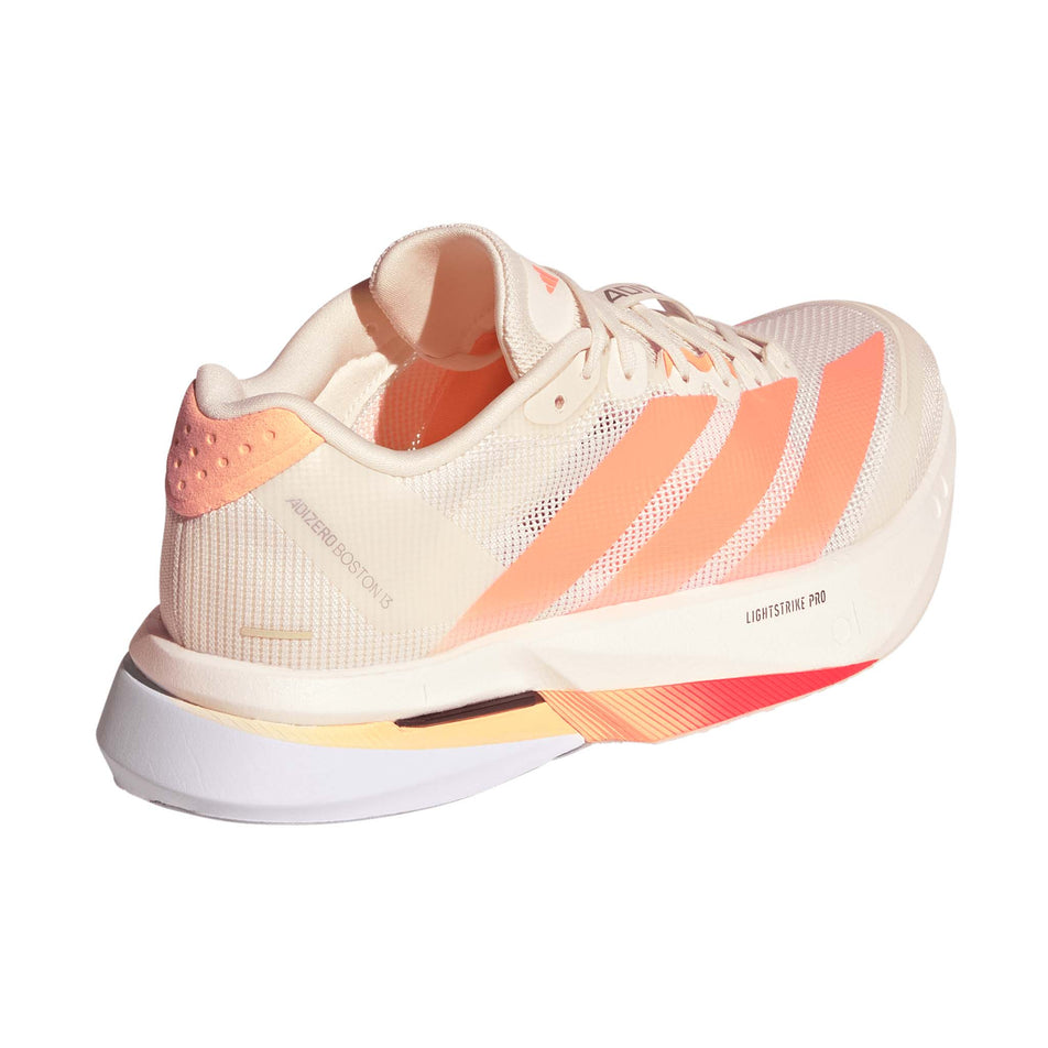 Lateral view of the right shoe from a pair of adidas Women's Adizero Boston 13 Running Shoes in the Off White/Beam Orange/Acid Orange colourway.