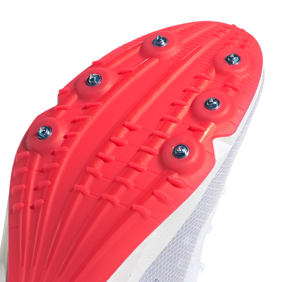 Close-up view of the spike plate of the right shoe from a pair of adidas Distancestar Running Spikes in the Ftwr White/Lucid Orange/Lucid Red colourway.