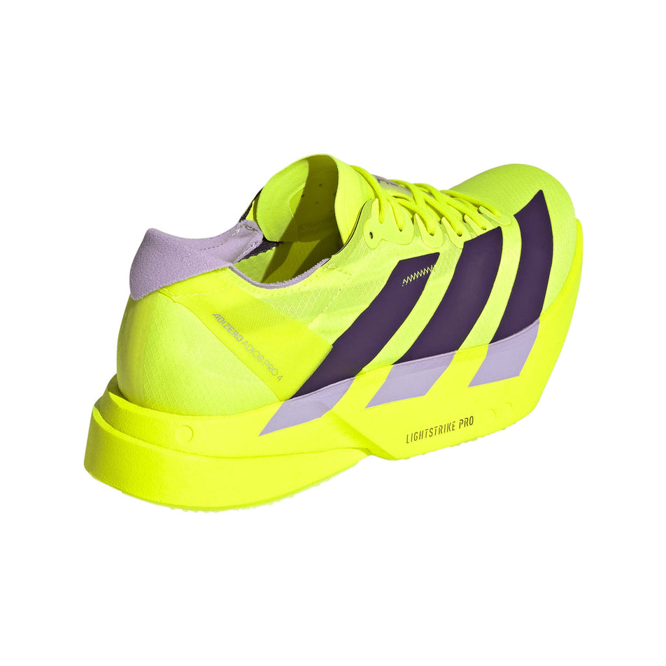 Lateral view of the right shoe from a pair of adidas Women's Adizero Adios Pro 4 Running Shoes in the Solar Yellow/Aurora Plum/Powder Plum colourway.