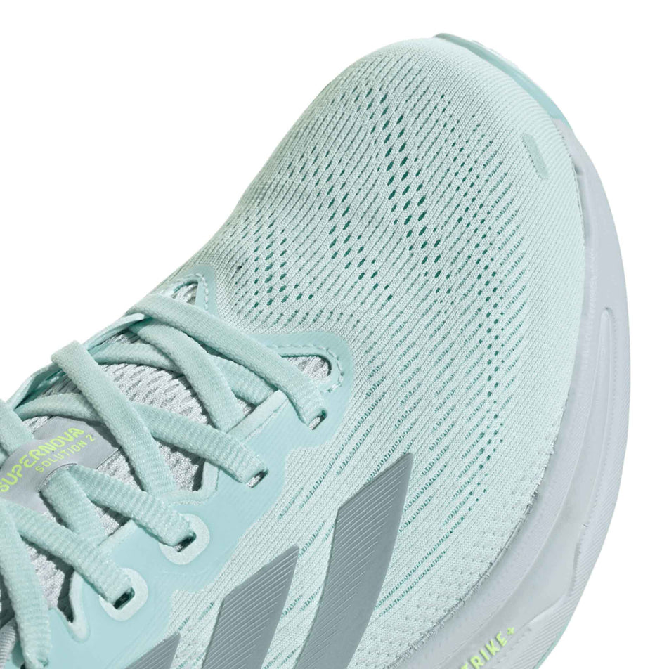 Close up of the toe box of the right shoe from a pair of adidas Women's Supernova Solution 2 Running Shoes in the Halo Mint/Magic Grey Met/Mint Ton colourway. (8663002710178)