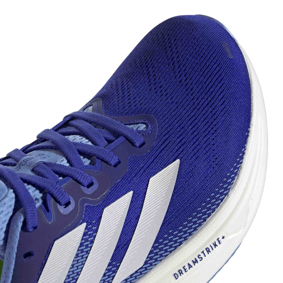 Close up of the toe box of the right shoe from a pair of adidas Men's Supernova Solution 2 Running Shoes in the Lucid Blue/Zero Met./Lucid Lemon colourway. (8662548250786)