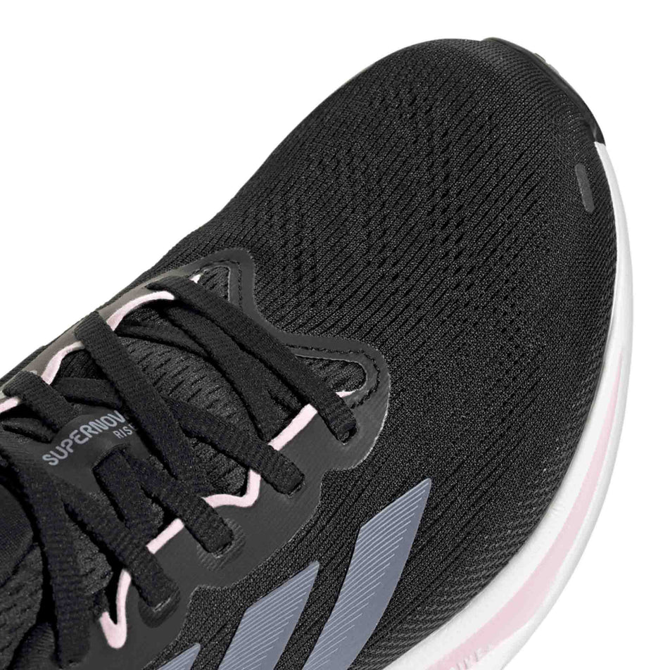 Close up of the toe box of the right shoe from a pair of adidas Women's Supernova Rise 2 Running Shoes Core Black/Silver Violet/Clear Pink colourway. (8662999695522)