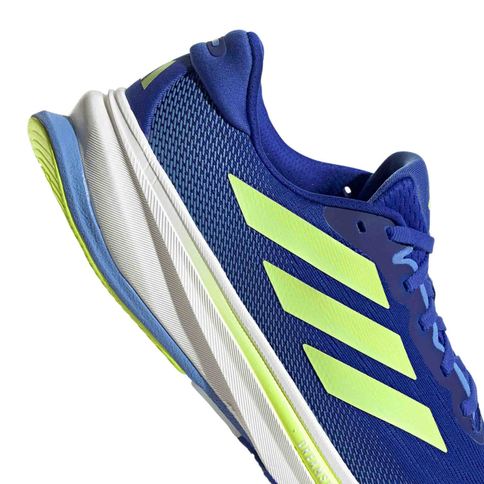 Close up of the heel section of the right shoe from a pair of adidas Men's Supernova Rise 2 Running Shoes in the Lucid Blue/Hi-Red Yellow/Blue Fusion colourway. (8662545006754)