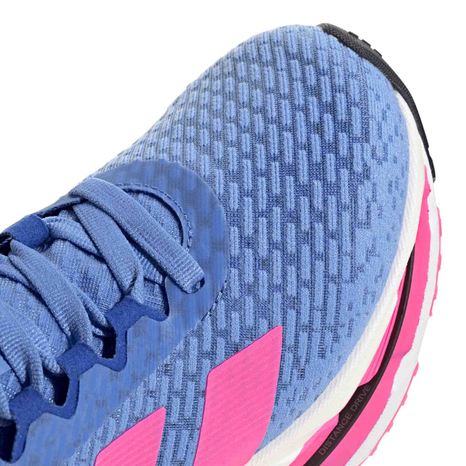 Close up view of the toe box of the right shoe from a pair of adidas Women's Adistar BYD Running Shoes Blue Fusion/Lucid Pink/Lucid Blue colourway. (8662994976930)