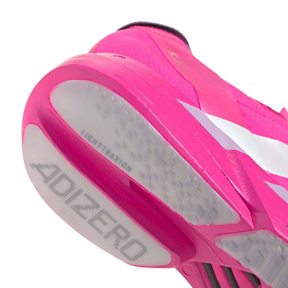 Close-up of the outsole rubber of the right shoe from a pair of adidas Men's Adizero Adios Pro 4 Running Shoes in the Shock Pink/Zero Met./Aurora Plum colourway. (8743557595298)