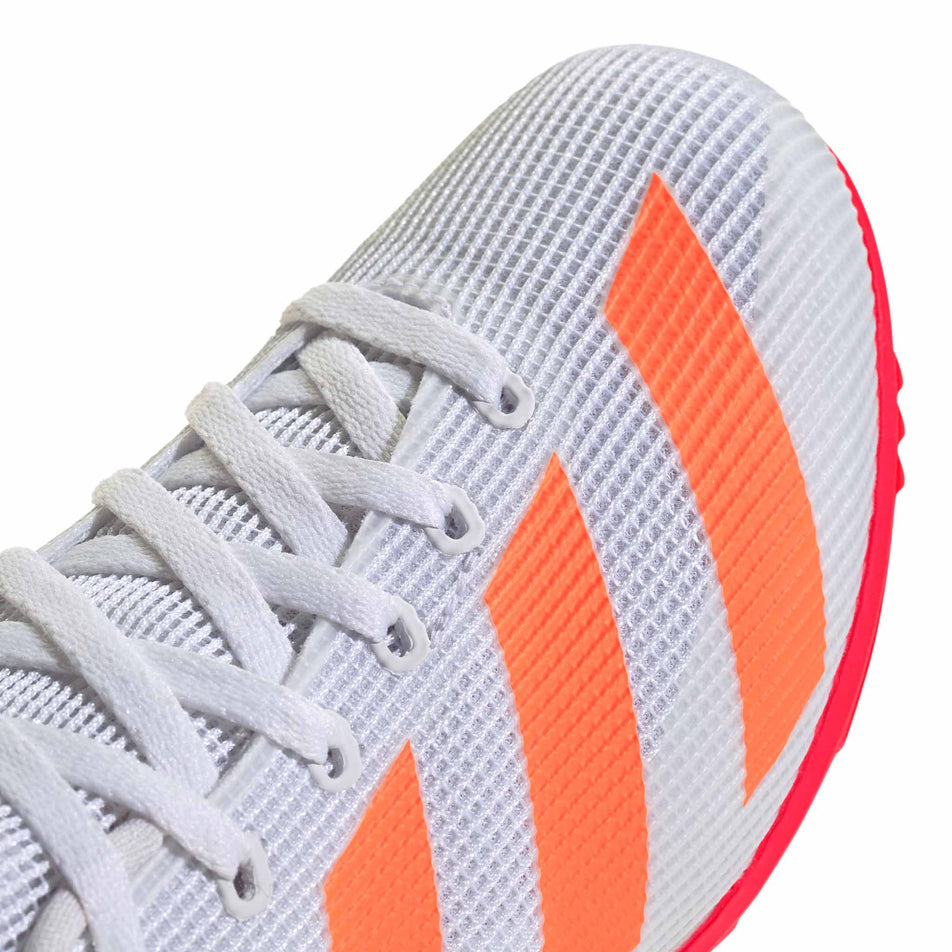 Close-up view of the toebox of the right shoe from a pair of adidas Junior-Unisex Allroundstar Running Spikes in the Pure Orange/Core Black/Silver Met. colourway.