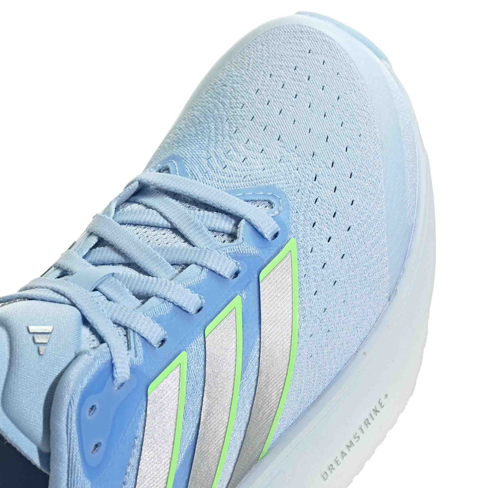 Close-up view of the toe box of the right shoe from a pair of adidas Women's Supernova Solution 3 Running Shoes in the Crystal Sky/Silver met./Lime Burst colourway.