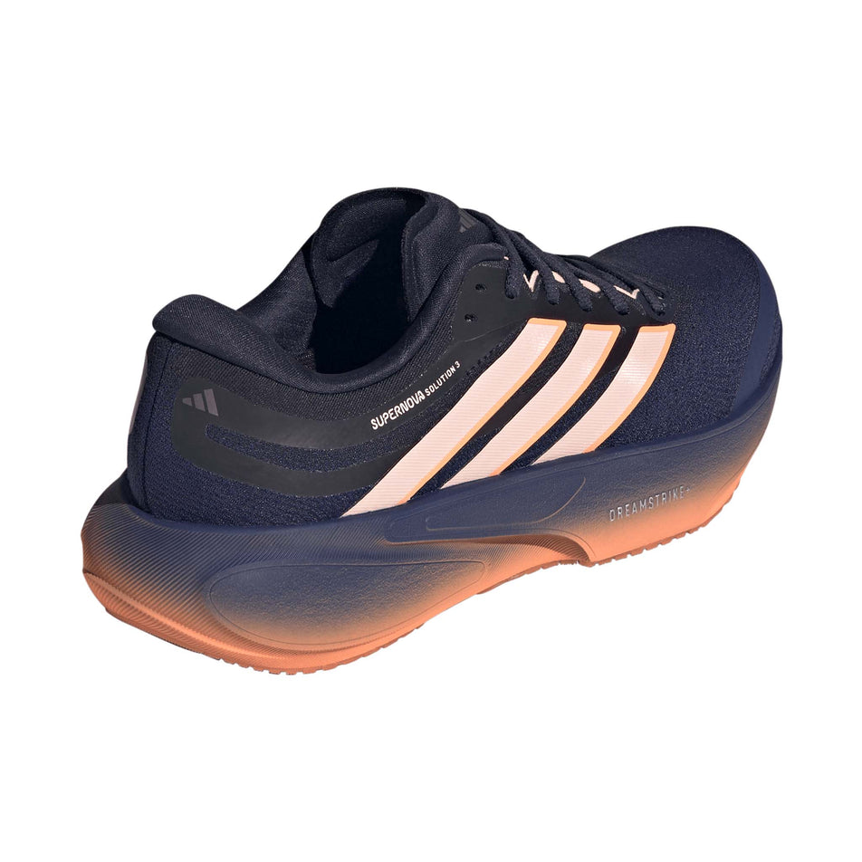 Lateral view of the right shoe from a pair of adidas Women's Supernova Solution 3 Running Shoes in the Dark Blue/Clear Orange/Beam Orange colourway.