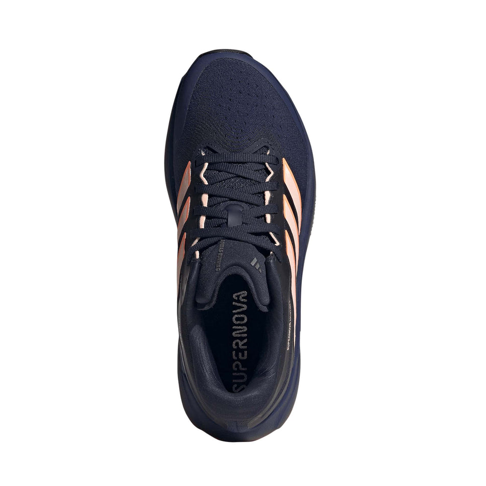 The upper of the right shoe from a pair of adidas Women's Supernova Solution 3 Running Shoes in the Dark Blue/Clear Orange/Beam Orange colourway.