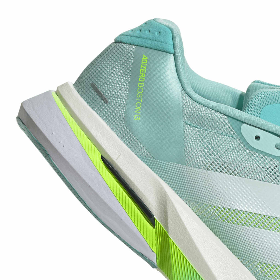 Close up of the heel section of the right shoe from a pair of adidas Women's Adizero Boston 13 Running Shoes in the Semi Flash Aqua/Zero Met./Lucid Lemon colourway. (8662573187234)