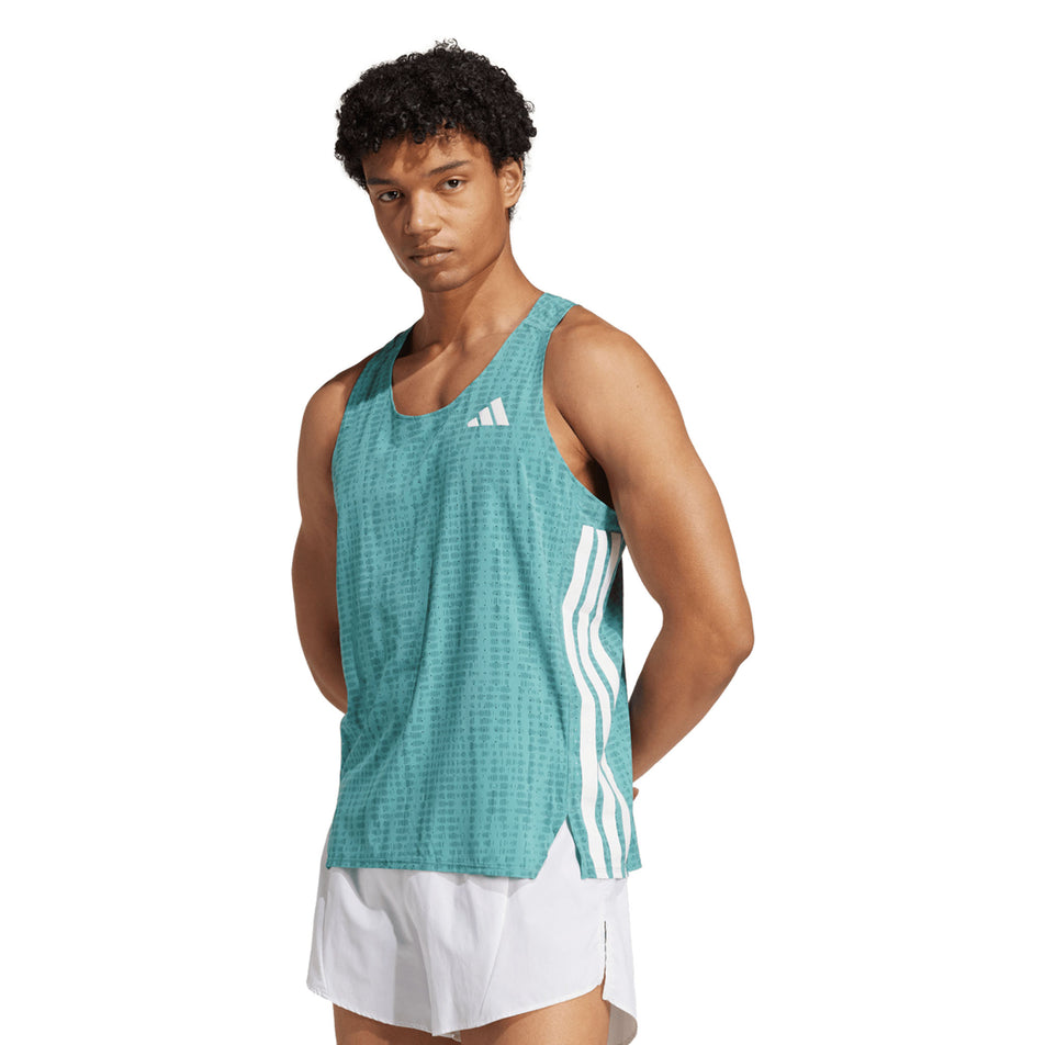 Front view of a model wearing the adidas Men's Adizero Singlet in the Powder Teal/Preloved Teal colourway. (8663045603490)