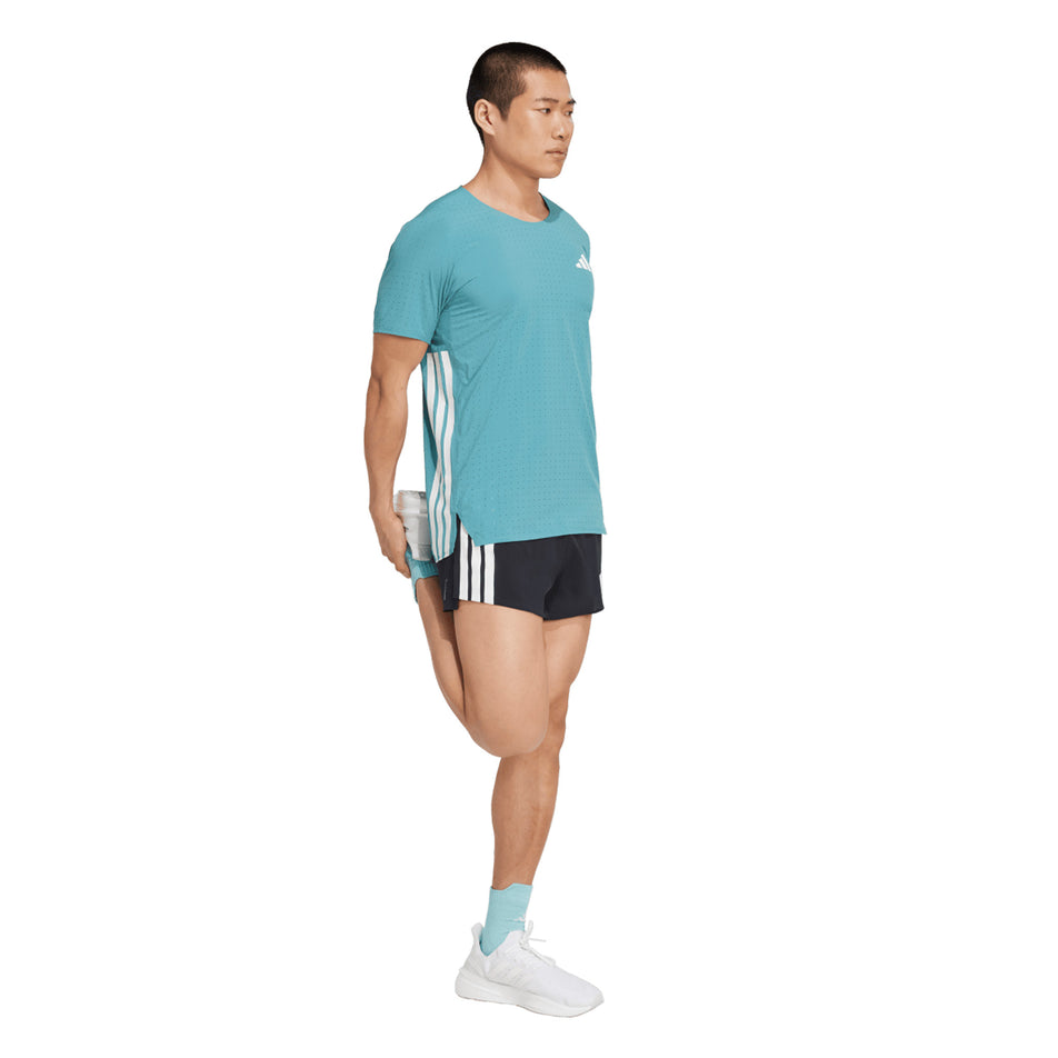 Front view of a model wearing the adidas Men's Adizero Tee in the Powder Teal colourway. (8663046881442)