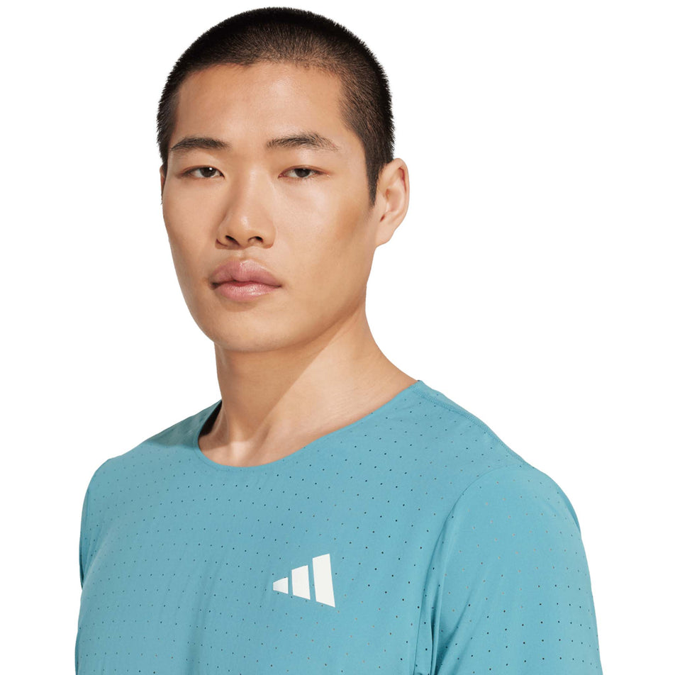 Front view of a model wearing the adidas Men's Adizero Tee in the Powder Teal colourway. (8663046881442)