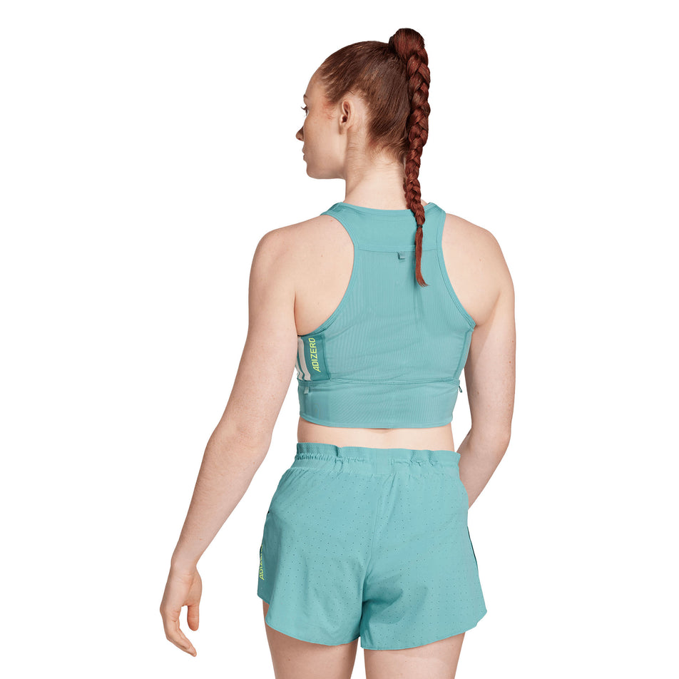 Back view of a model wearing the adidas Women's Adizero Crop in the Powder Teal colourway. (8665221529762)