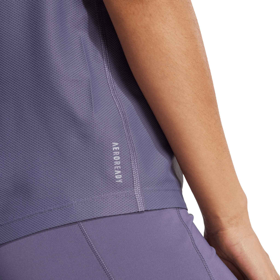 The AEROREADY branding on the adidas Women's Own The Run Base Tee in the Preloved Violet colourway. (8665231327394)