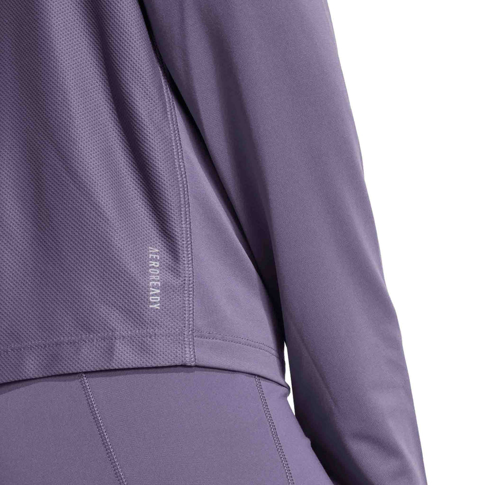 Close-up view of the AEROREADY branding on the adidas Women's Own The Run Half Zip in the Preloved Violet colourway. (8751042527394)