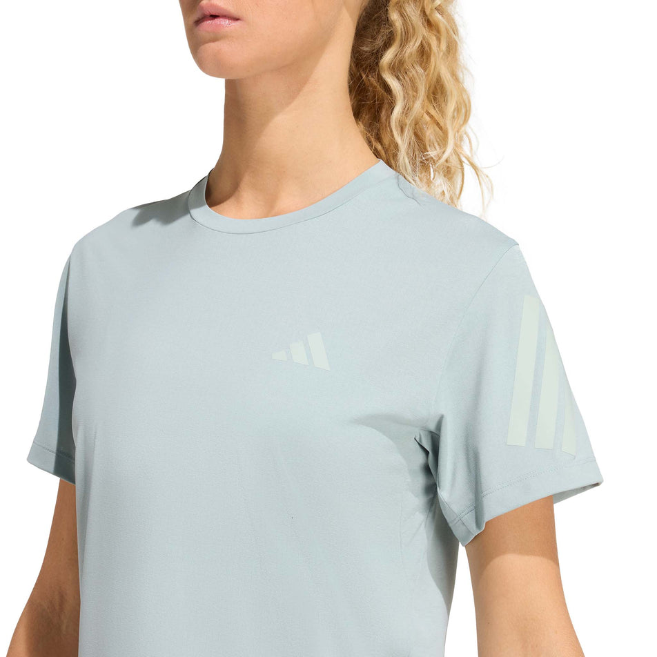 Front view of a model wearing the adidas Women's adi365 Tee in the Wonder Sage colourway.