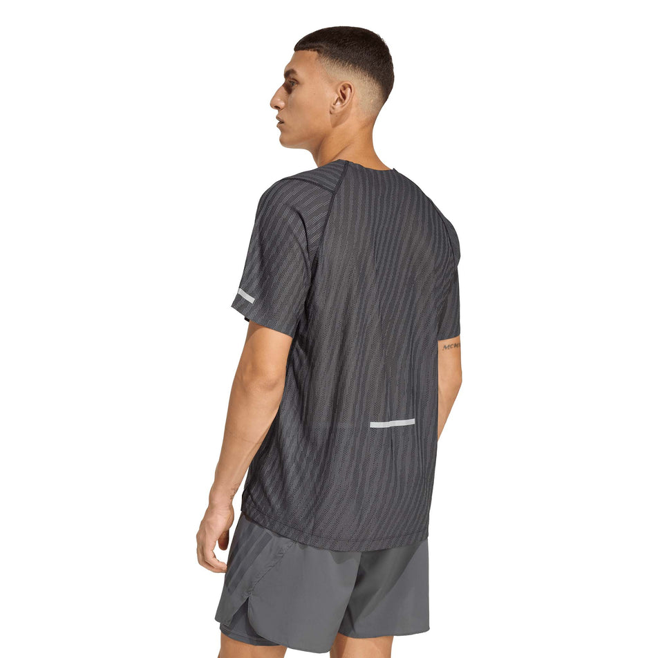 Back view of a model wearing the adidas Men's adi365 Co Tee in the Black colourway.