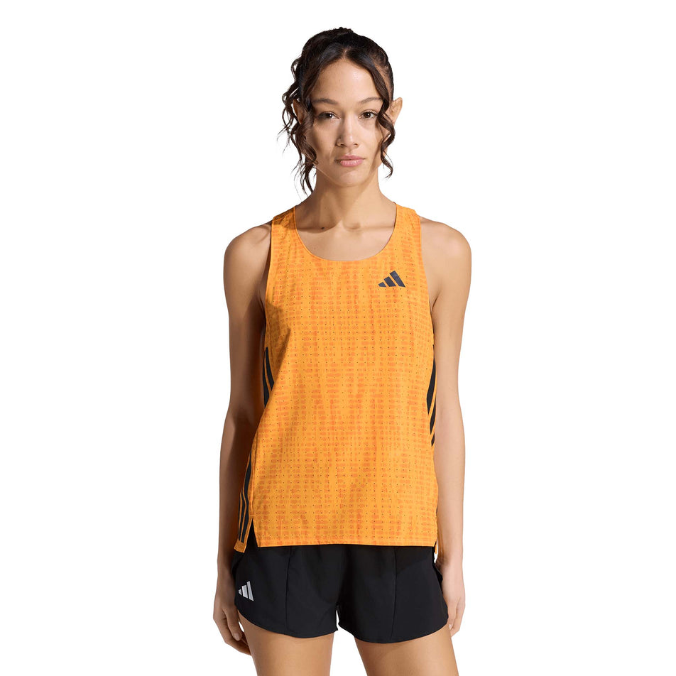 Front view of a model wearing the adidas Women's Adizero Singlet in the Pure Tangerine/Pure Orange colourway.