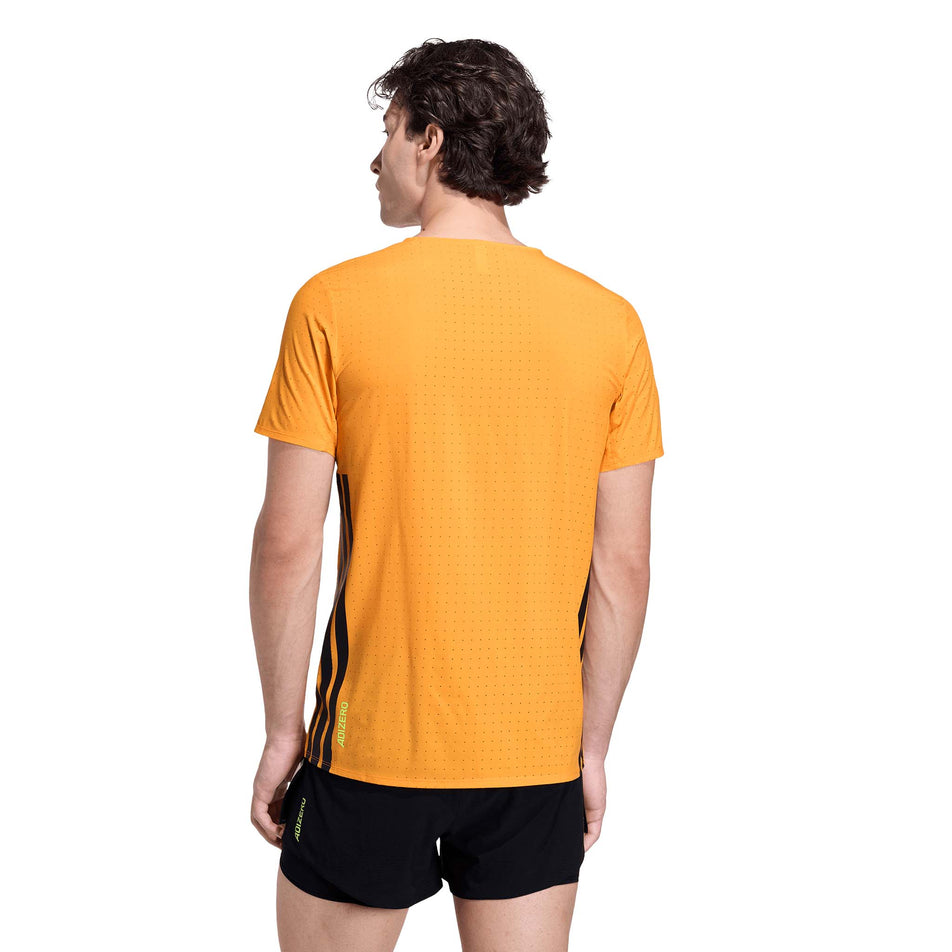 Back view of a model wearing the adidas Men's Adizero Tee in the Pure Tangerine colourway.