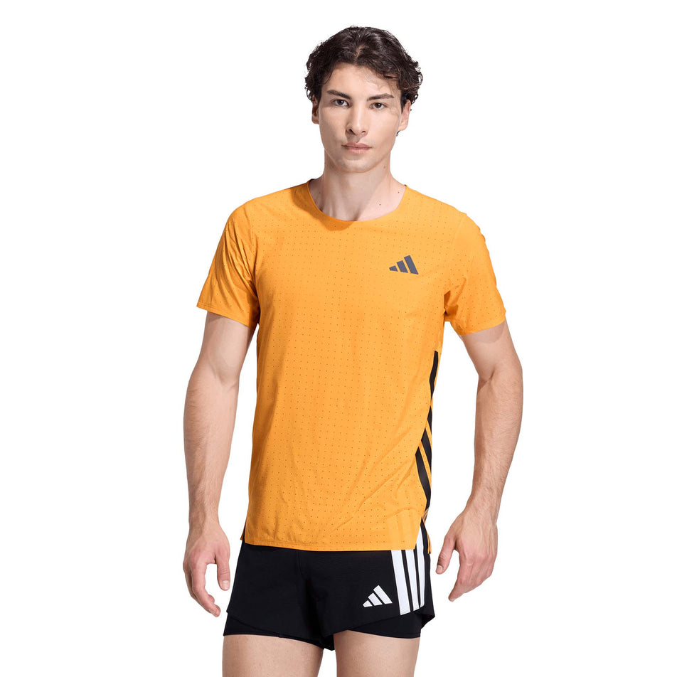 Front view of a model wearing the adidas Men's Adizero Tee in the Pure Tangerine colourway.