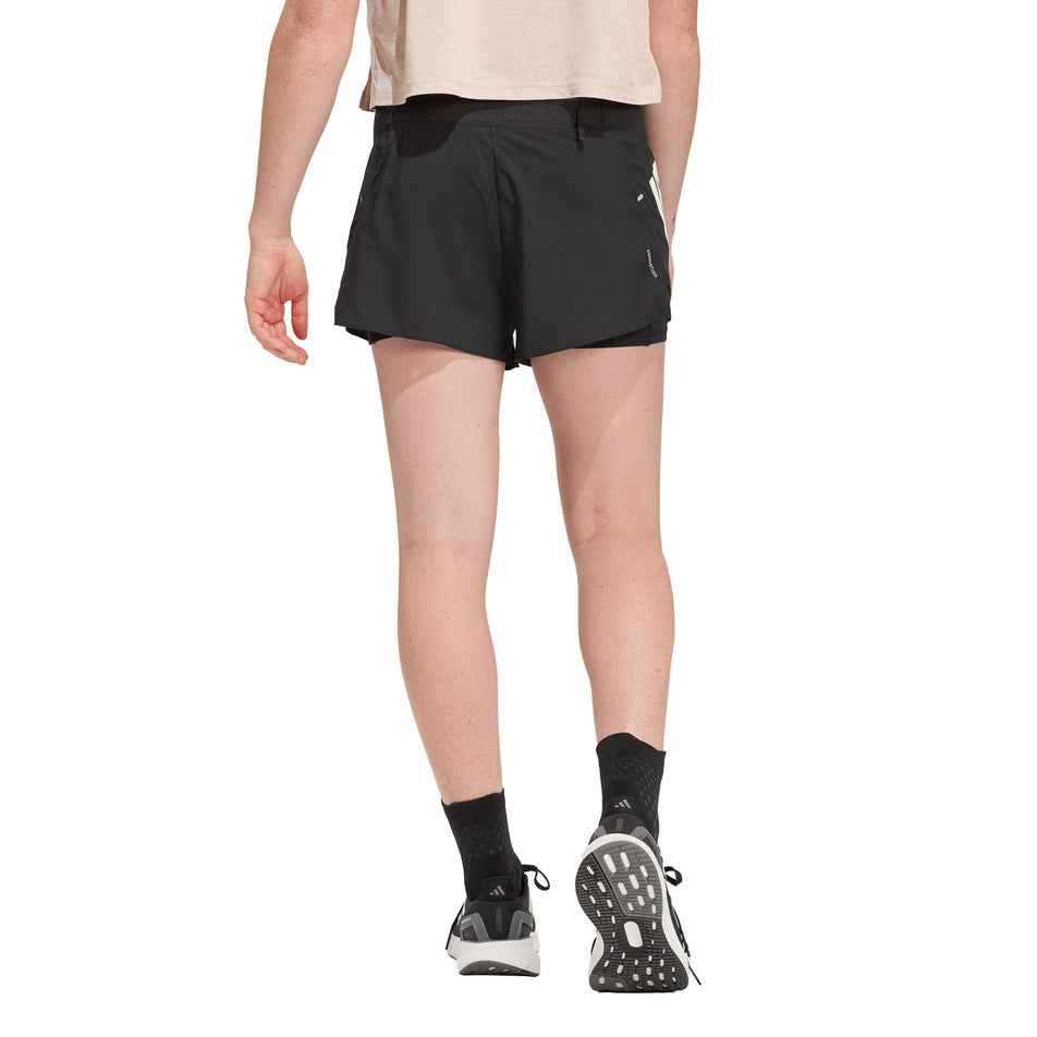 Back view of a model wearing the adidas Women's adi365 2in1 Short in the Black colourway.