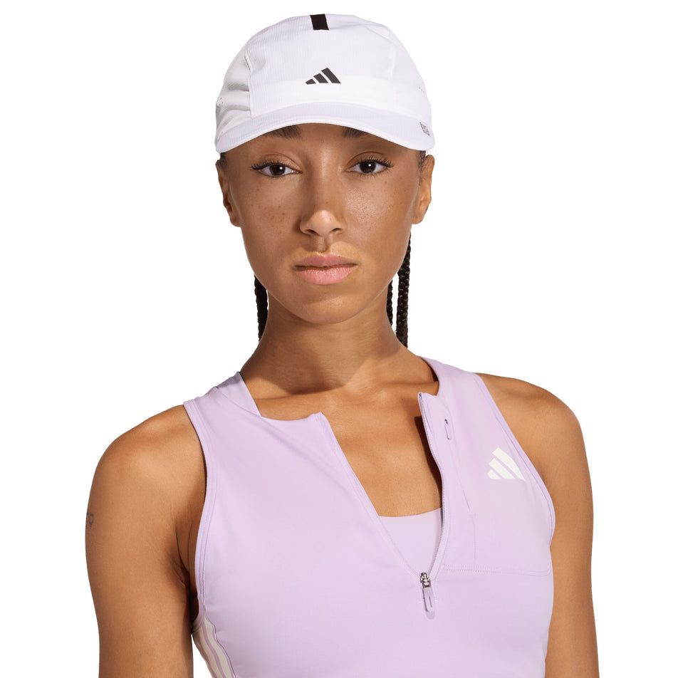 Front view of a model wearing the adidas Unisex Run x Adizero Cap in the White/Black colourway.
