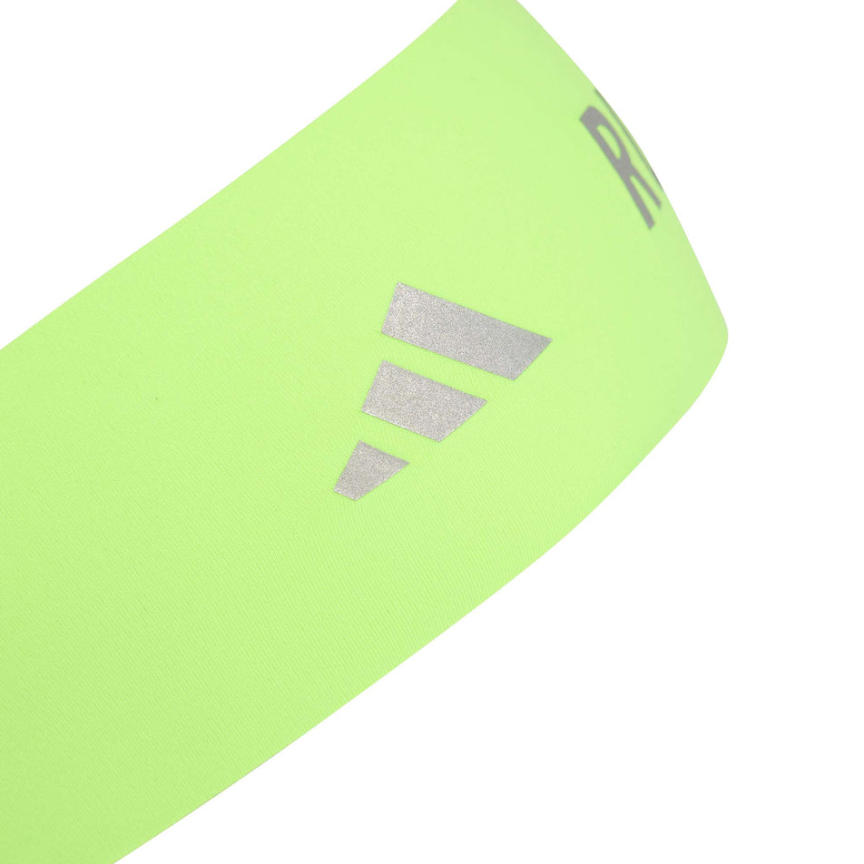 The adidas Unisex Run CC Headband in the Solar Yellow/Reflective Silver colourway.