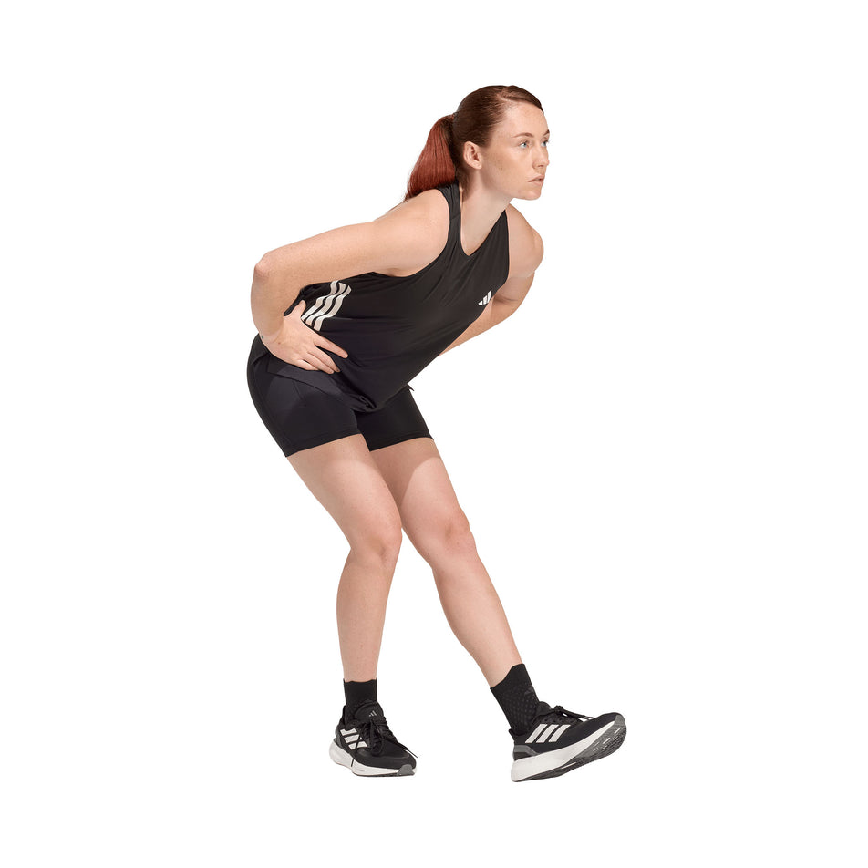 Angled view of a model wearing the adidas Women's adi365 Climacool Running Short Leggings in the Black colourway.