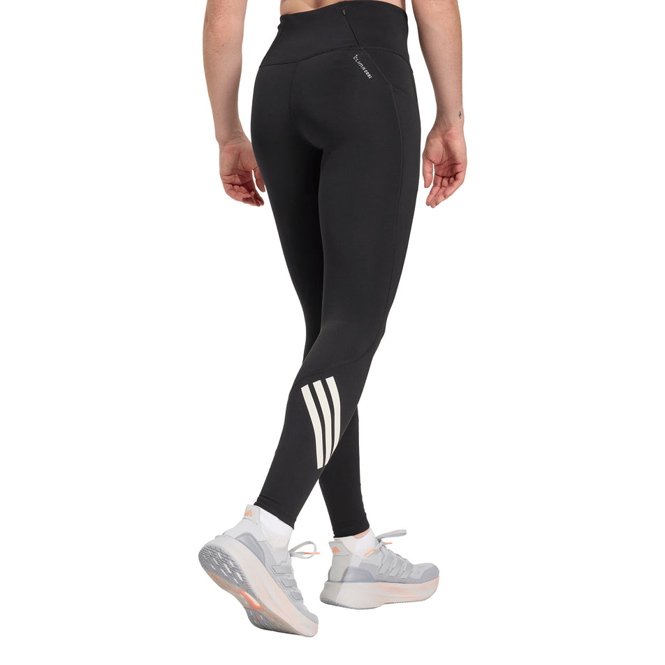 Back view of a model wearing the adidas Women's adi365 3S 1/1 Tights in the Black colourway.