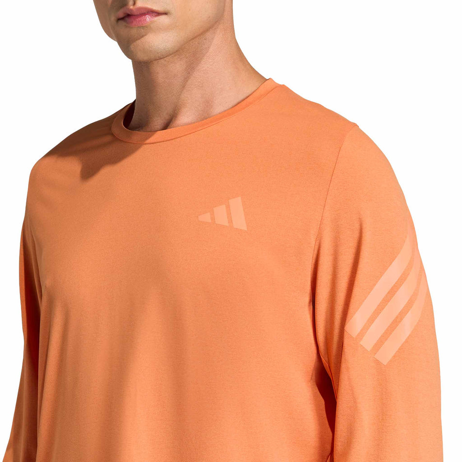 Front view of a model wearing the adidas Men's adi365 Long Sleeve in the Dusky Orange colourway.