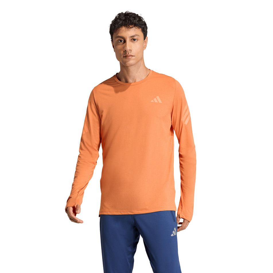 Front view of a model wearing the adidas Men's adi365 Long Sleeve in the Dusky Orange colourway.