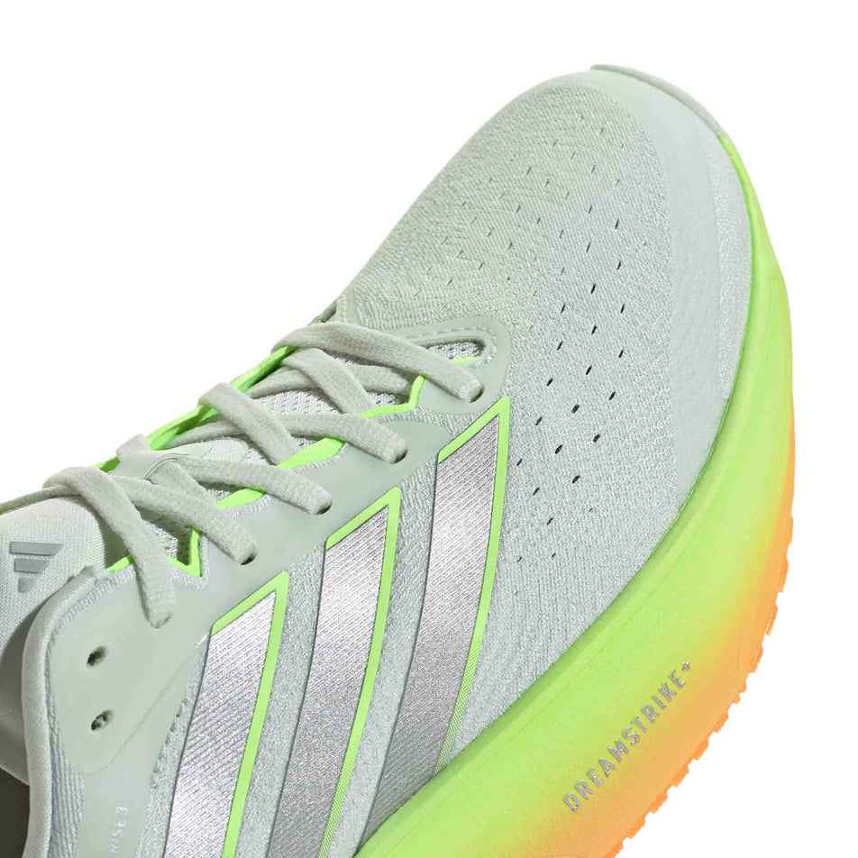 The toe box of the right shoe from a pair of adidas Men's Supernova Rise 3 Running Shoes in the Crystal Jade/Silver Met./Lucid Tangerine colourway.