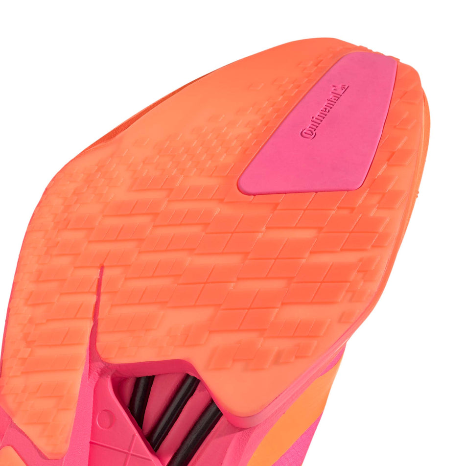 Close-up view of the outsole rubber of the right shoe from a pair of adidas Men's Adizero Adios Pro 4 Running Shoes in the Lucid Pink/Lucid Orange/Iron Met. colourway.