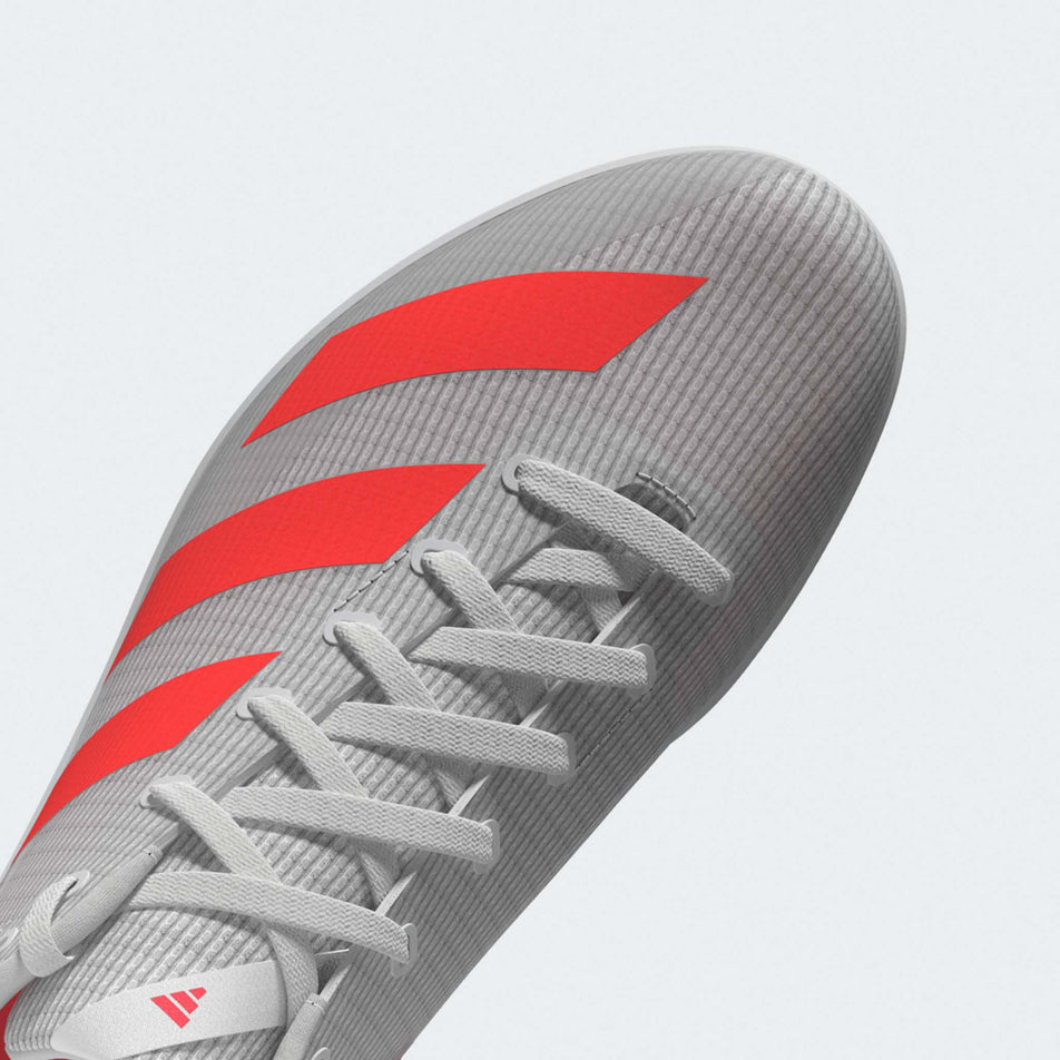 The upper of the left shoe from a pair of adidas Junior-Unisex Allroundstar Running Spikes in the Ftwr White/Solar Turbo/Gold Met. colourway.