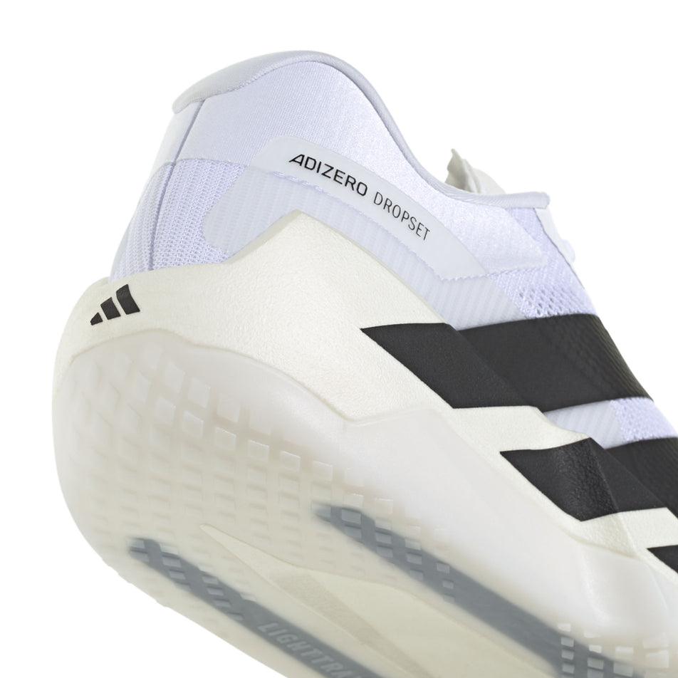 Close-up view of the rearfoot section of the right shoe from a pair of adidas Men's Adizero Dropset Pro Shoes in the Footwear White/Core Black/Footwear White colourway.
