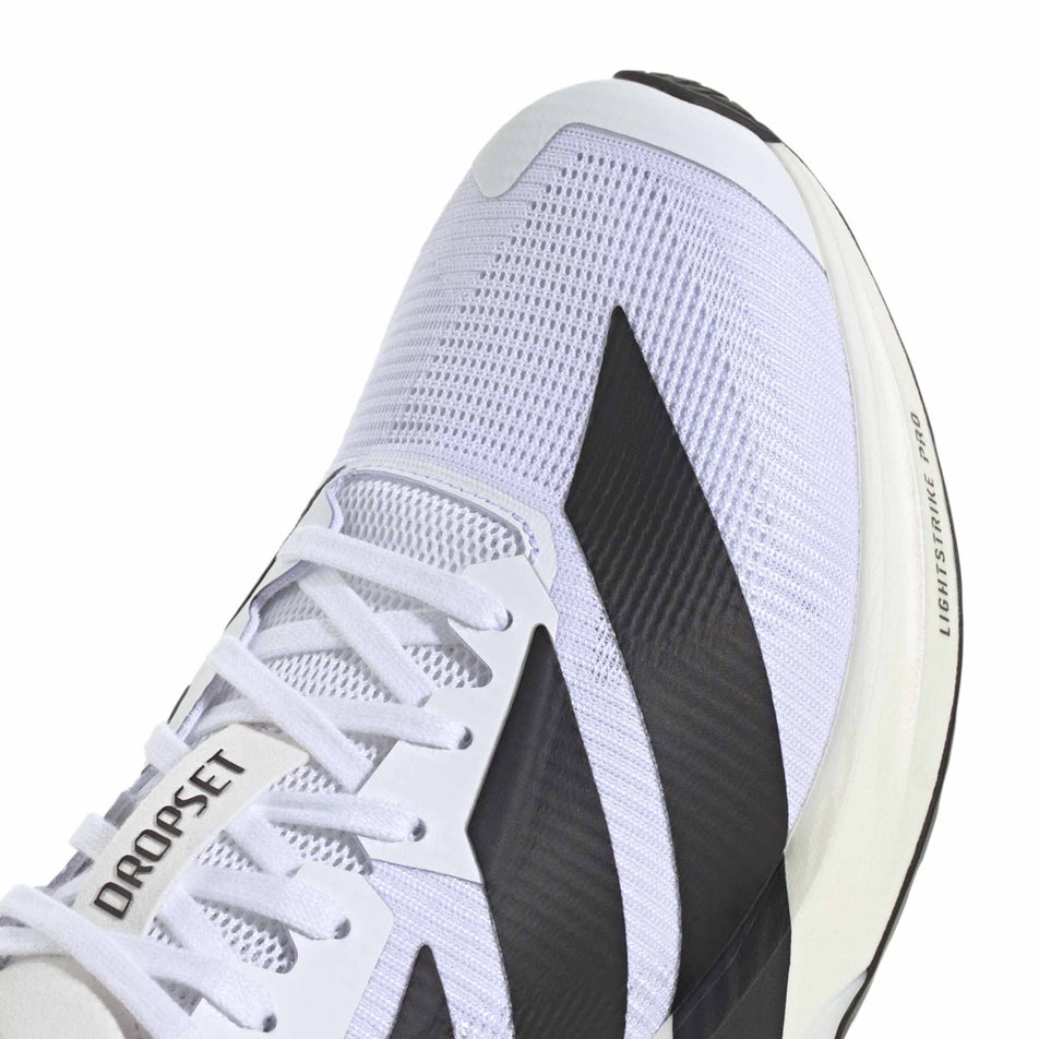 Close-up view of the toe box of the right shoe from a pair of adidas Men's Adizero Dropset Pro Shoes in the Footwear White/Core Black/Footwear White colourway.