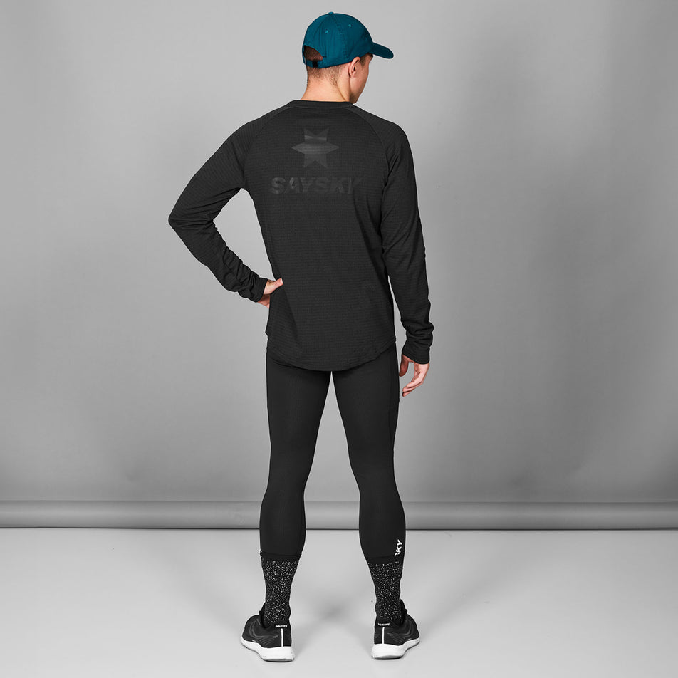 Back view of a model wearing the SAYSKY Men's Blaze Long Sleeve Light Fleece in the Black colourway. (8787584942242)