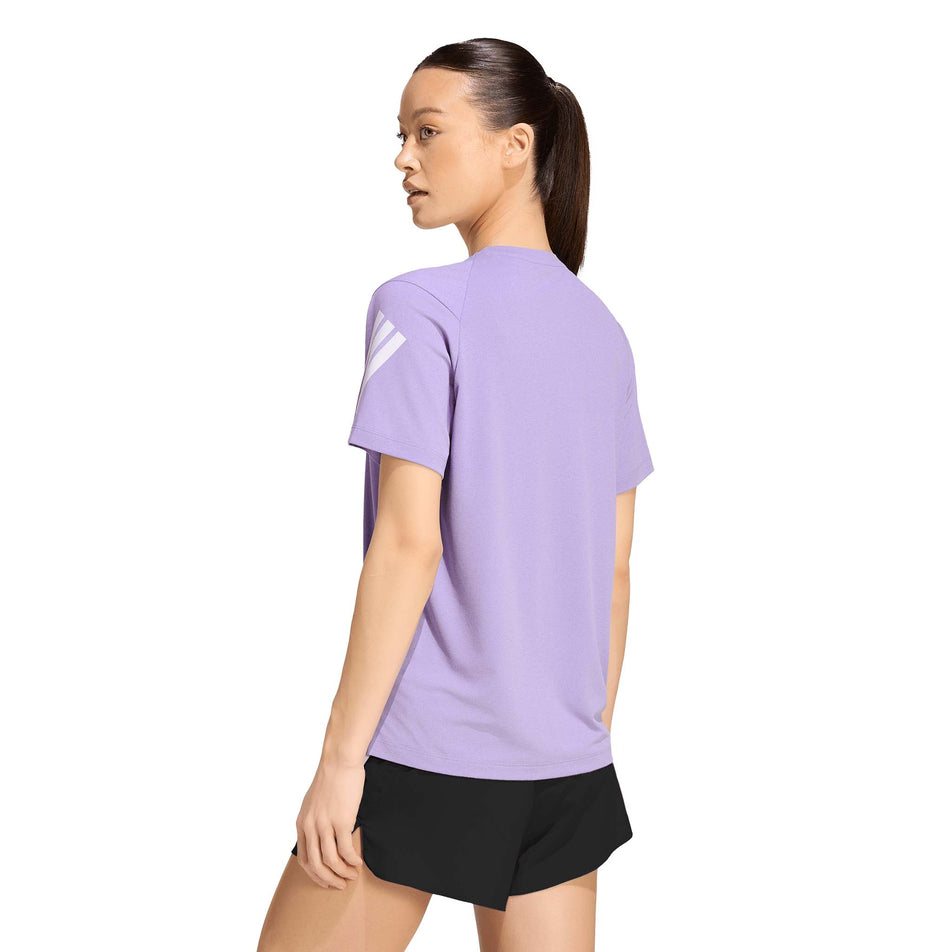 Back view of a model wearing the adidas Women's adi365 Tee in the Magic Lilac colourway.