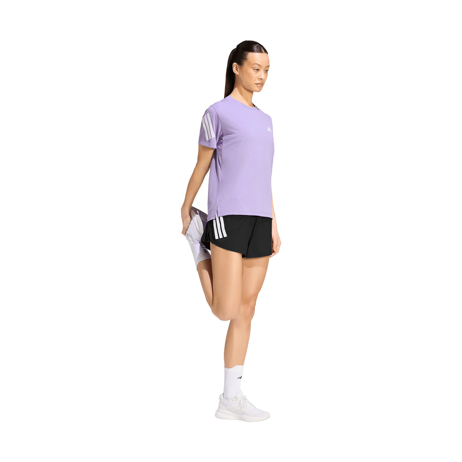 Angled view of a model wearing the adidas Women's adi365 Tee in the Magic Lilac colourway.