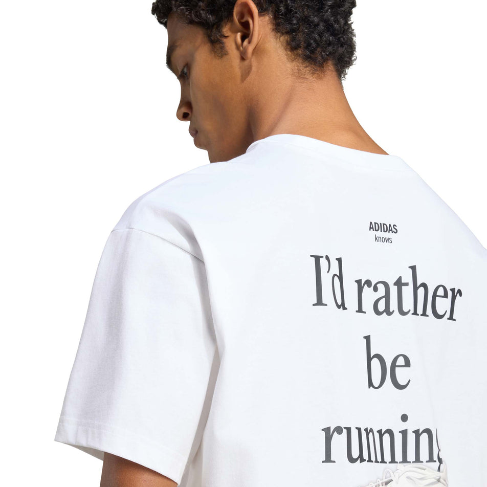 Back view of a model wearing the adidas Unisex Running Category Graphic T-Shirt in the White colourway.
