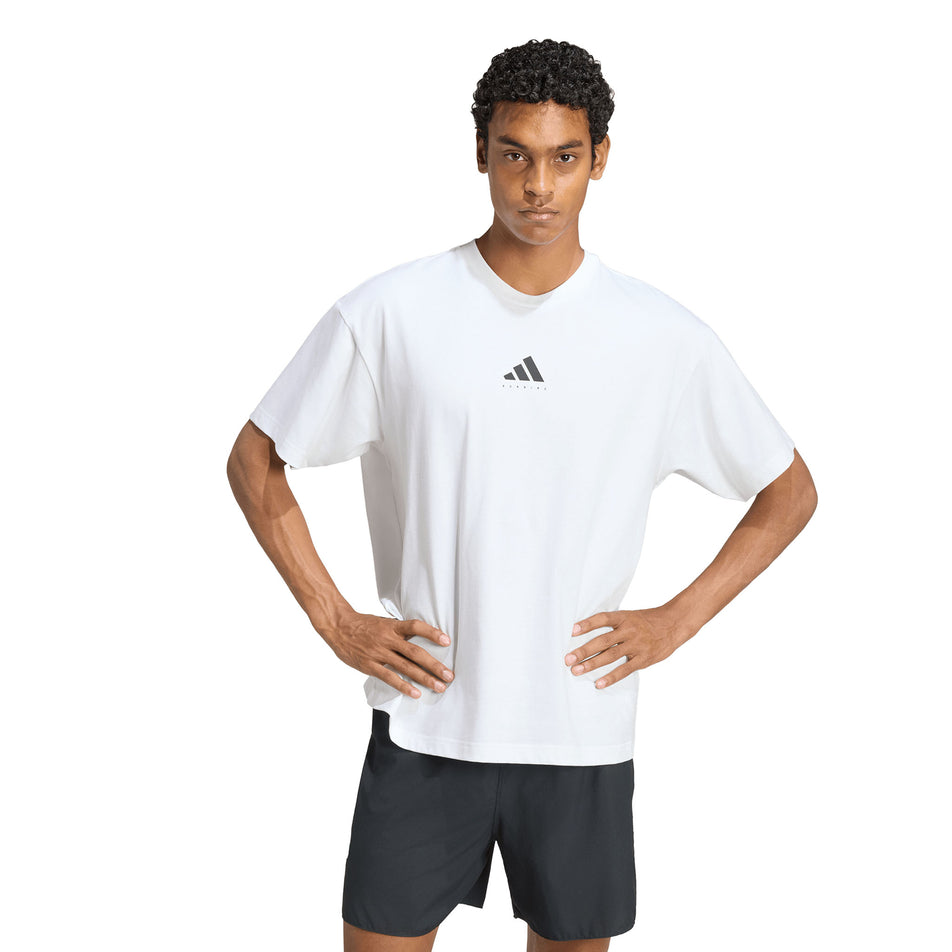 Front view of a model wearing the adidas Unisex Running Category Graphic T-Shirt in the White colourway.