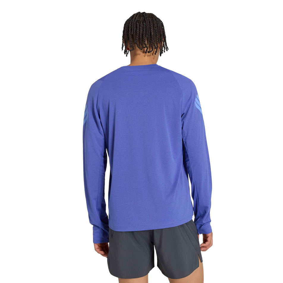 Back view of a model wearing the adidas Men's adi365 Long Sleeve Running Top in the Dual Indigo. colourway.