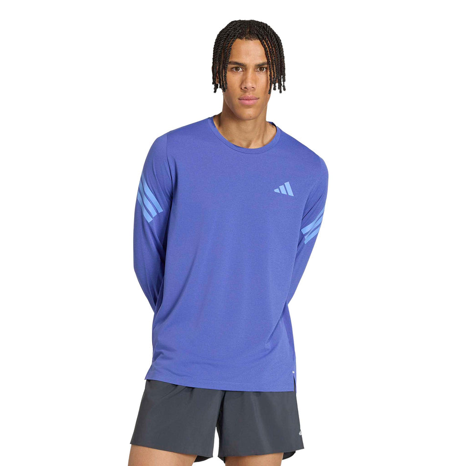 Front view of a model wearing the adidas Men's adi365 Long Sleeve Running Top in the Dual Indigo. colourway.