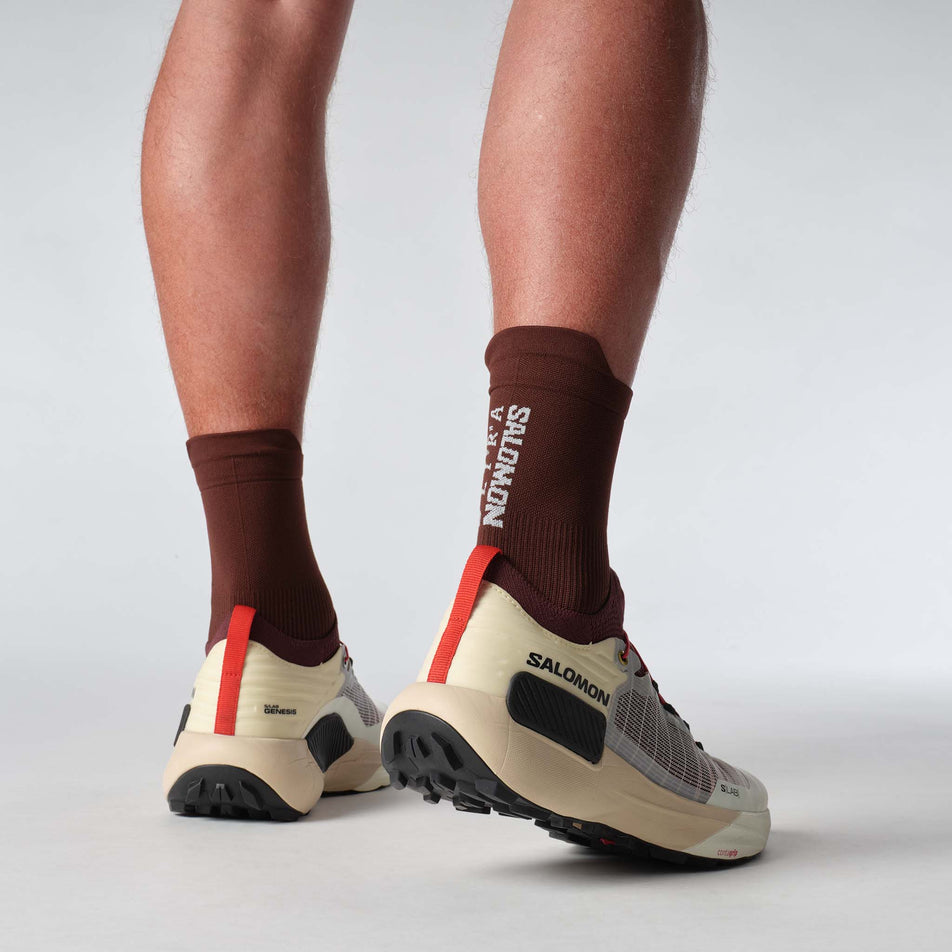 A model wearing a pair of Salomon Unisex S/LAB Genesis Running Shoes in the Vanilla Ice colourway. (8576038502562)