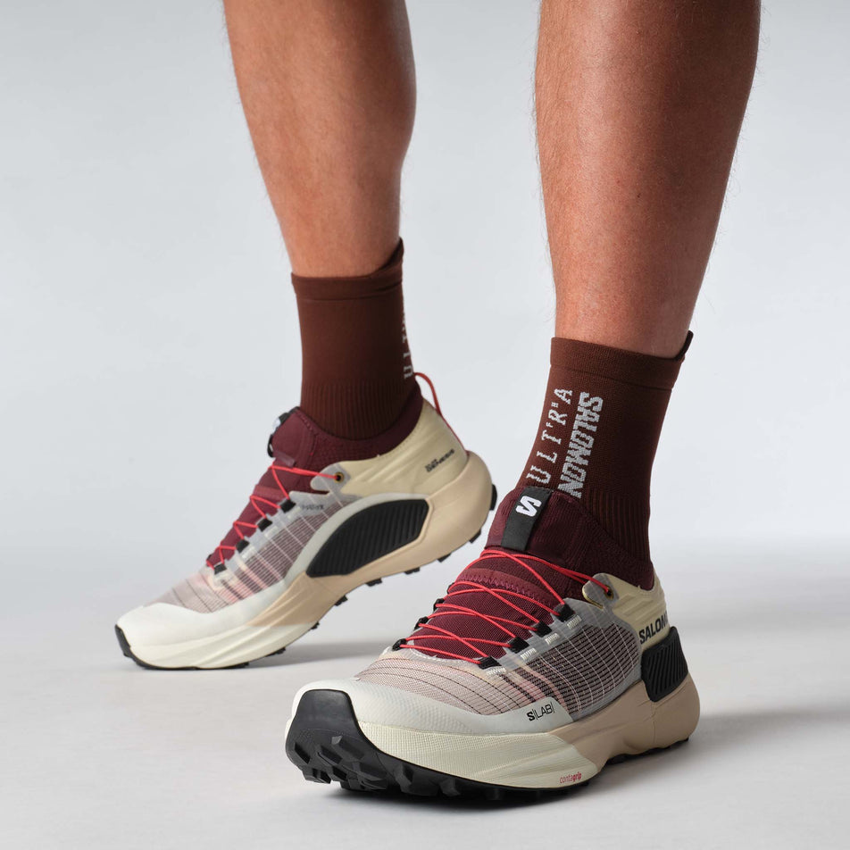 A model wearing a pair of Salomon Unisex S/LAB Genesis Running Shoes in the Vanilla Ice colourway. (8576038502562)