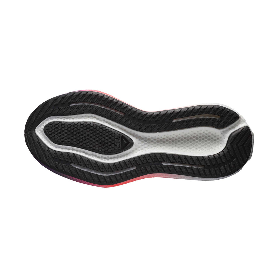 The outsole of the left shoe from a pair of Salomon Women's Aero Glide 3 Running Shoes in the Neon Flame/White/Black colourway. (8783549956258)